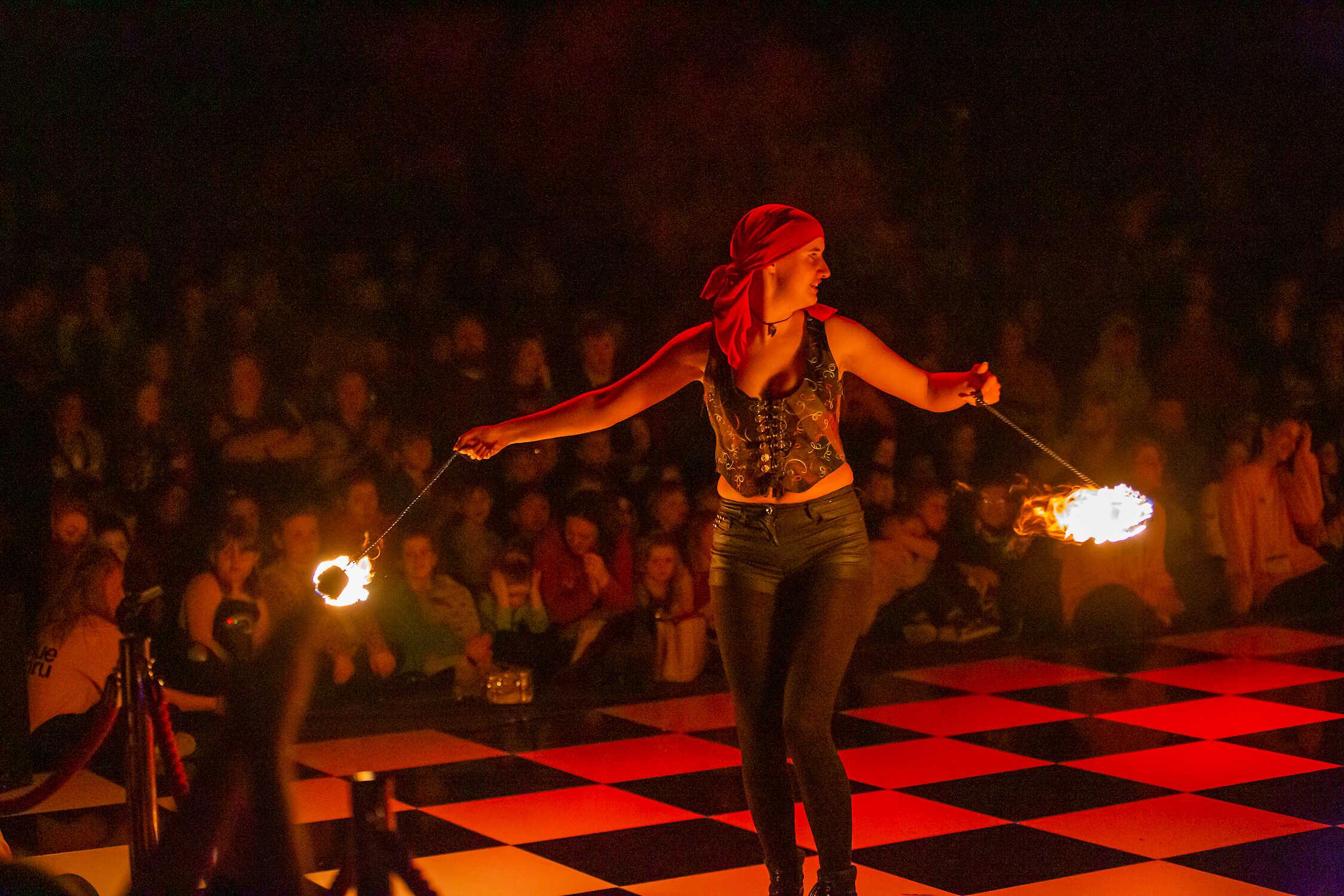 person dancing with fire