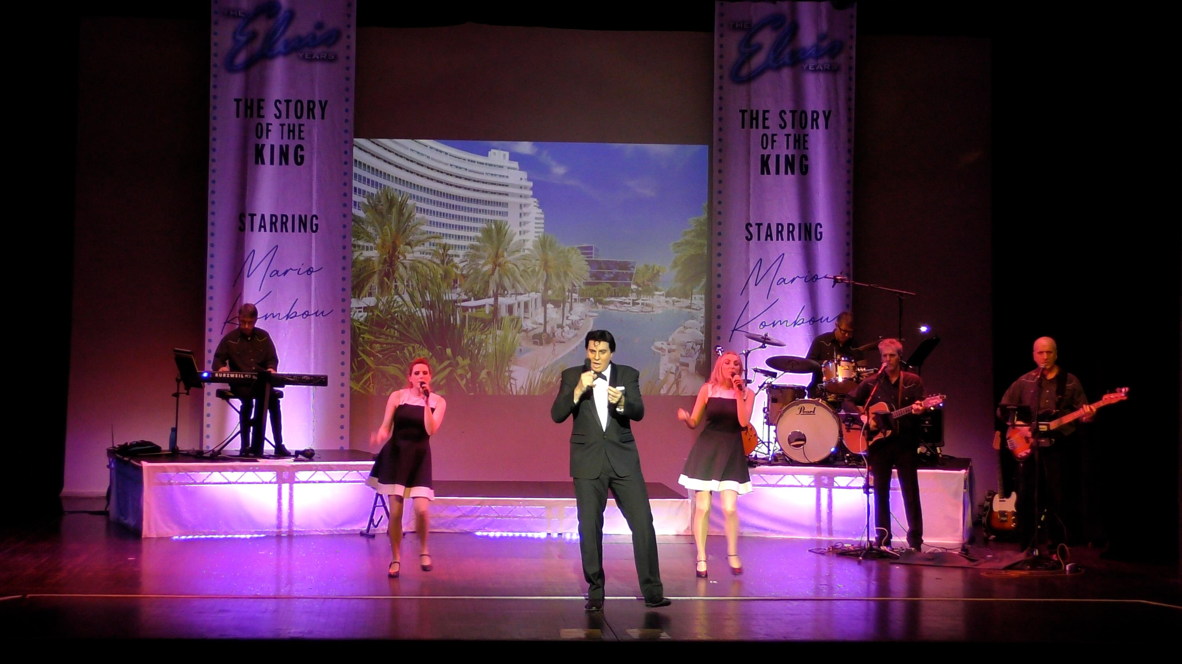 Man in evening suit singing on stage