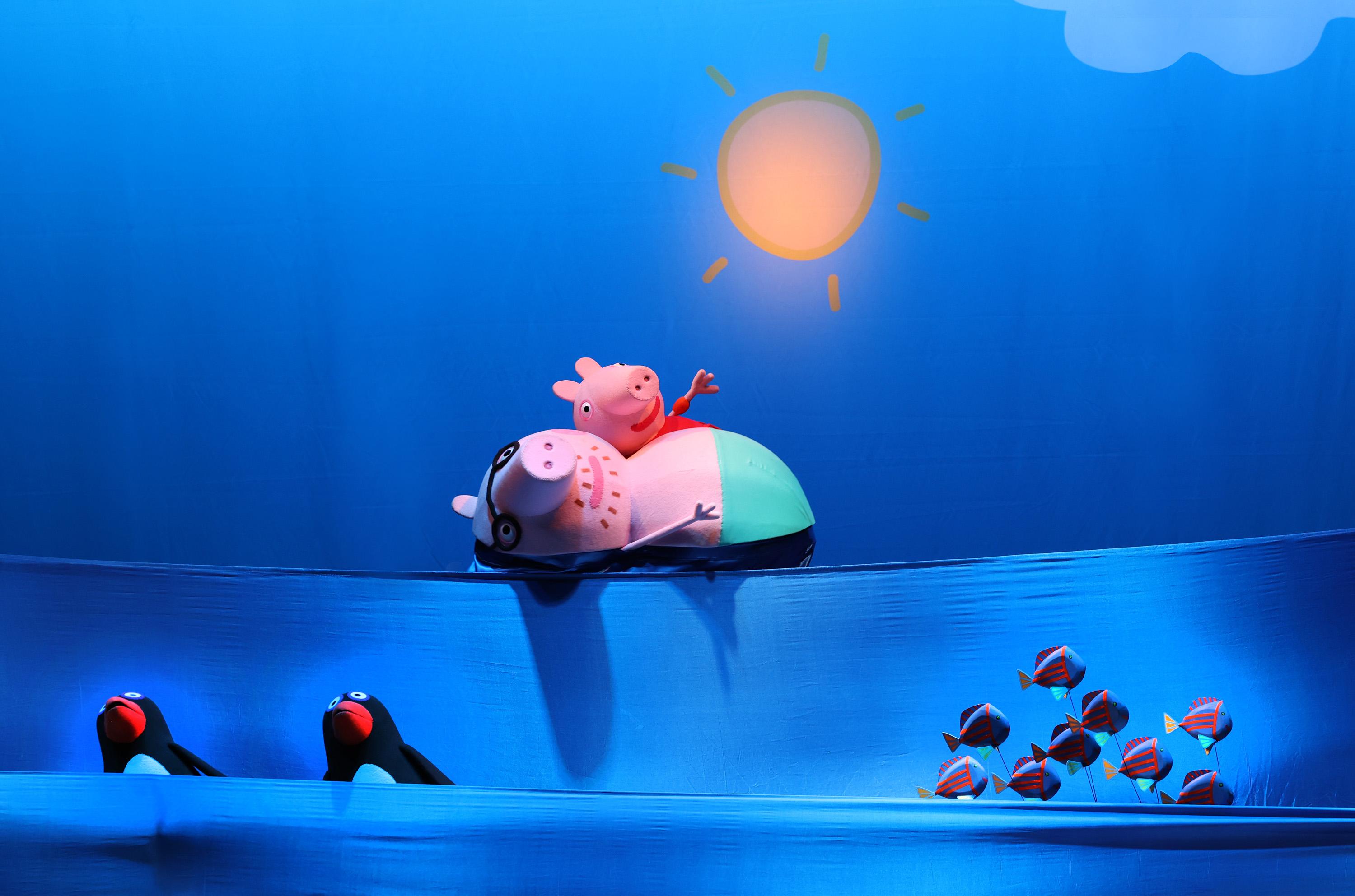 Daddy Pig and George Pig swimming in the ocean