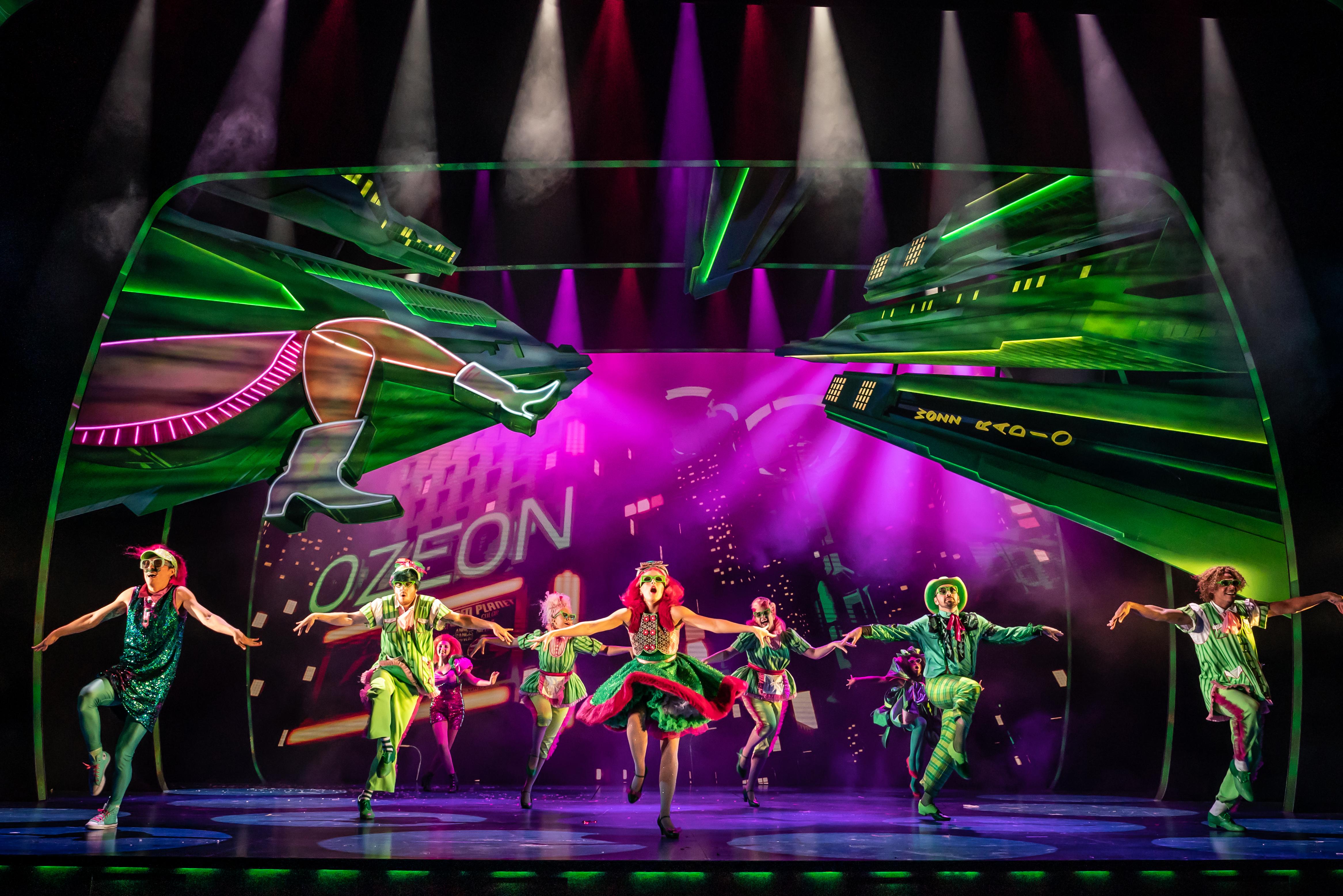 group of people dancing on stage