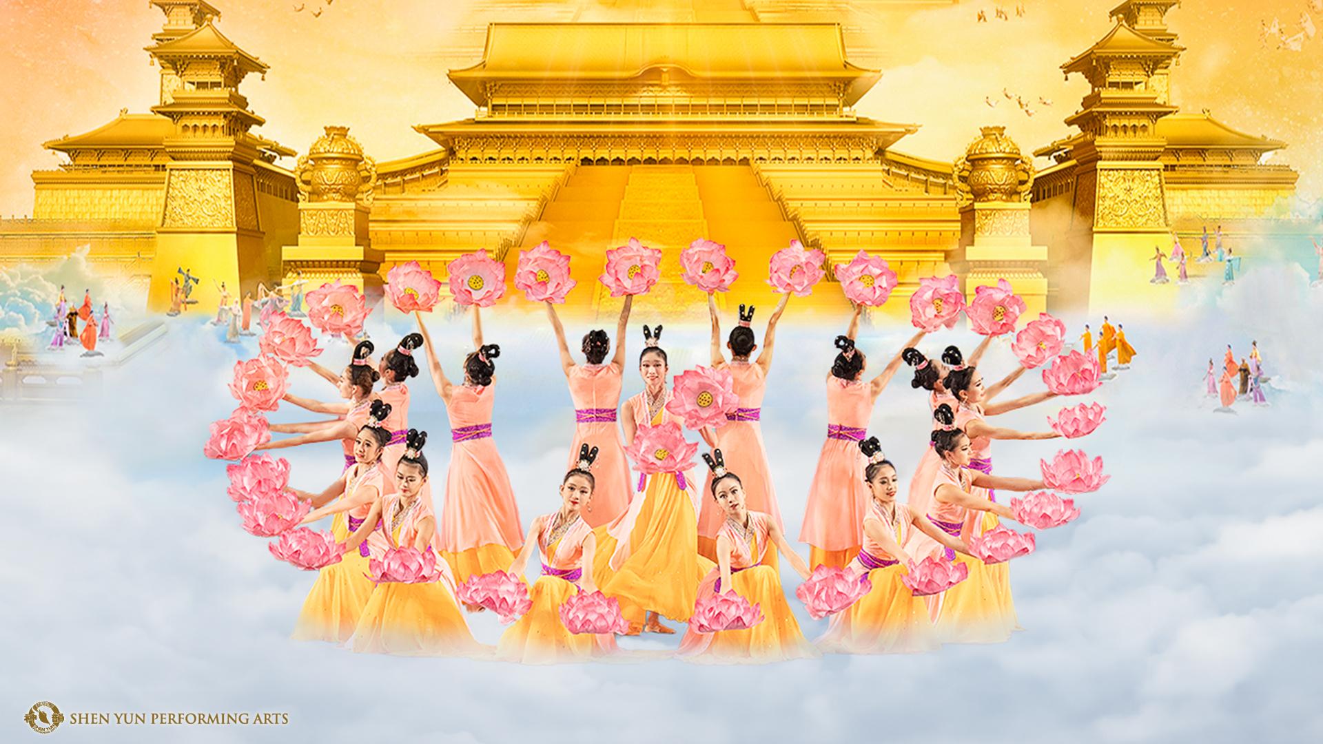 Group of dancers in a circle holding large pink flowers