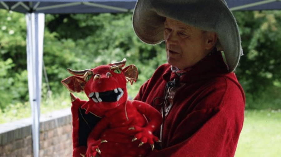 image of John Overton with a dragon puppet