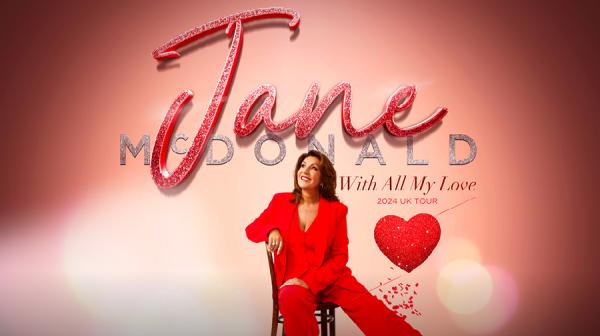 Lady wearing a red trouser suit sitting down with 'Jane' in glittery font above her.