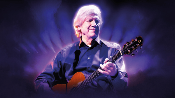 image of a man playing a guitar