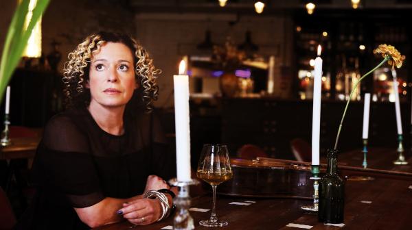 Kate Rusby surrounded by Christmas Candles