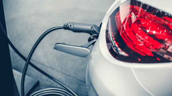 image of an ev charger plugged in to a car