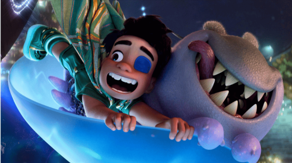 an animated boy wearing a blue eye patch has an alien next to him with a huge mouth and sharp teeth. they are holding onto some sort of sled and flying 